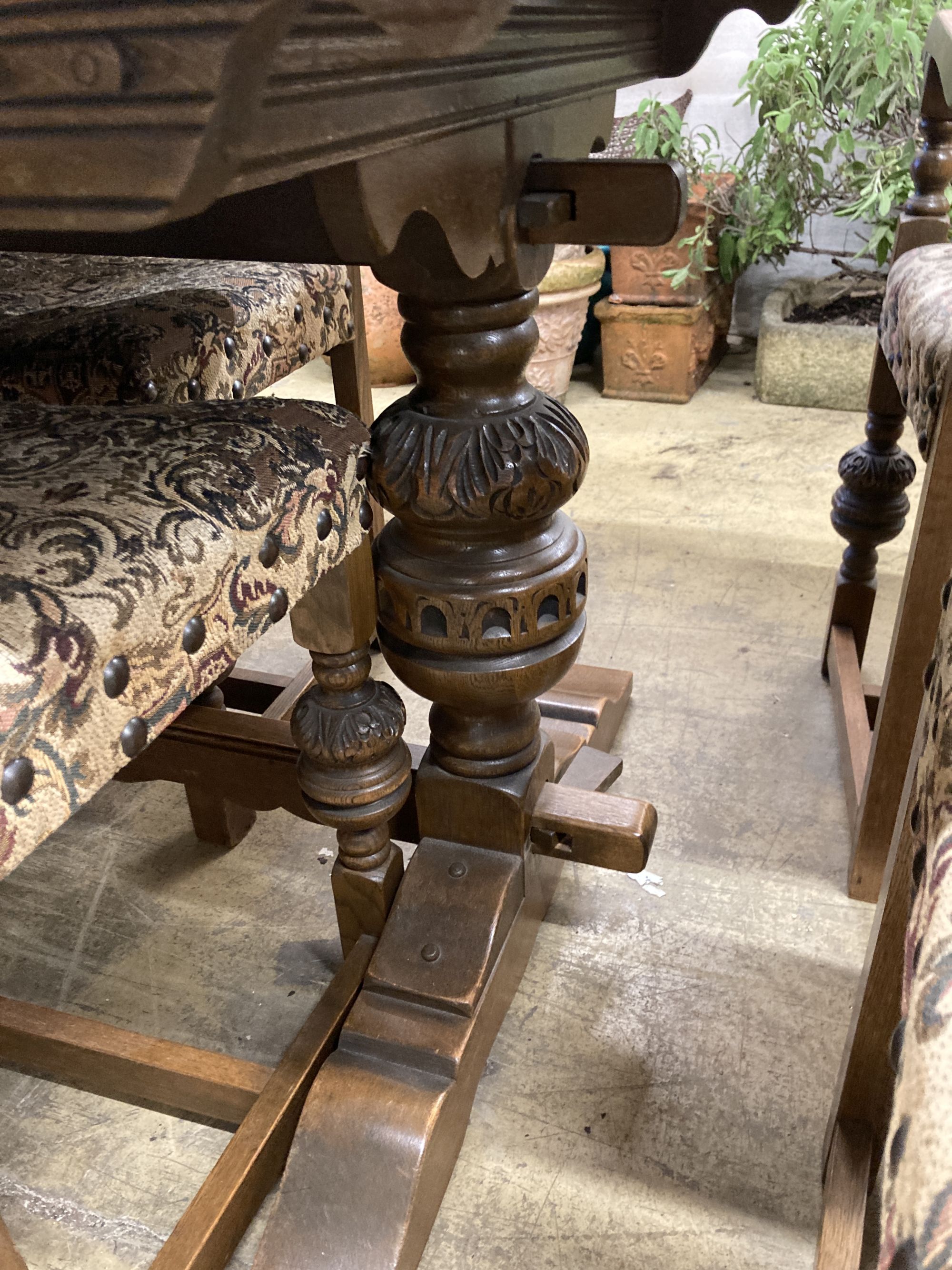 A rectangular 18th century style oak refectory dining table, length 182cm, depth 91cm, height 78cm, together with six matching dining chairs (two with arms)